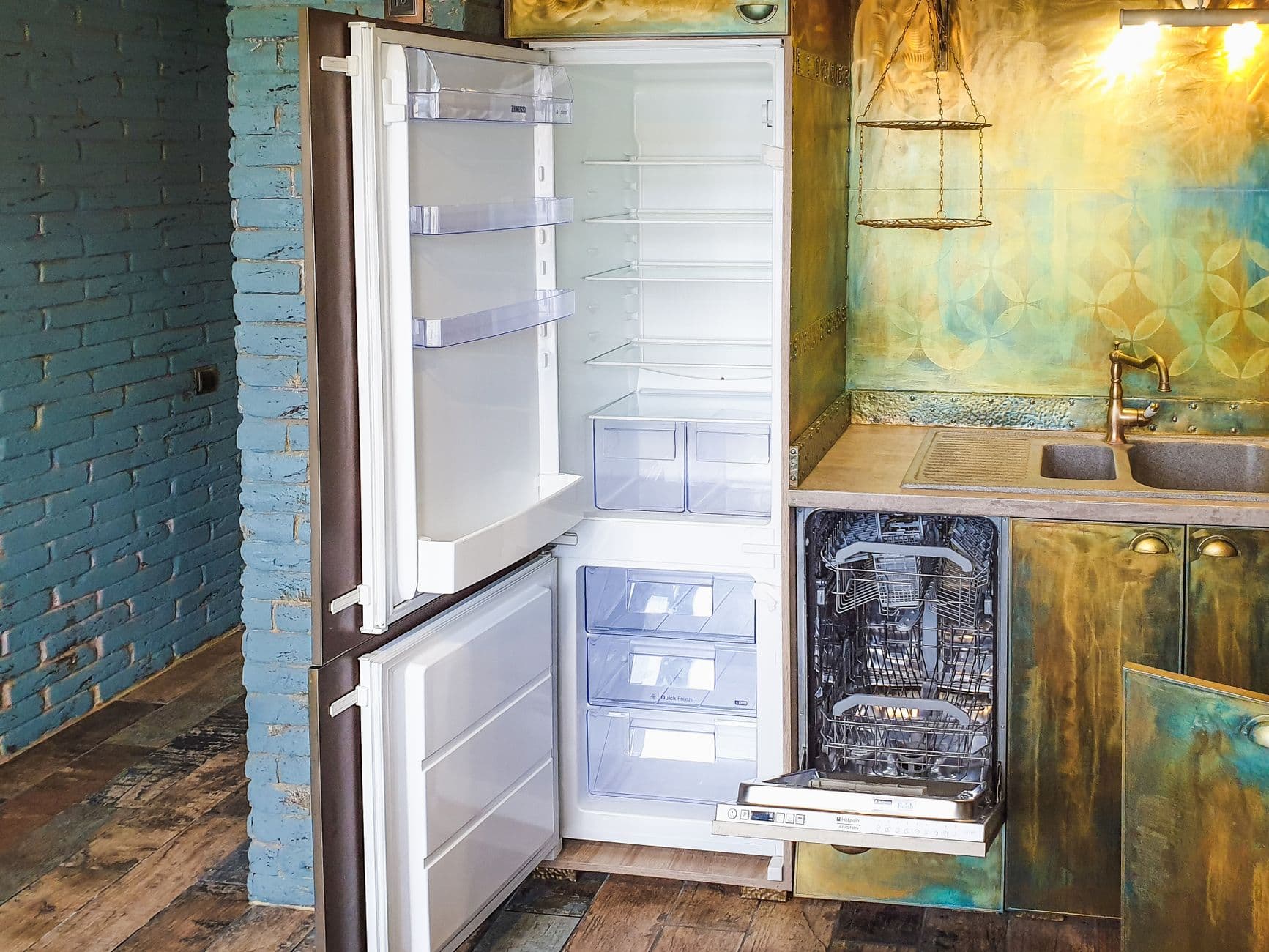 Technician checks the fridge in a Rapido motorhome